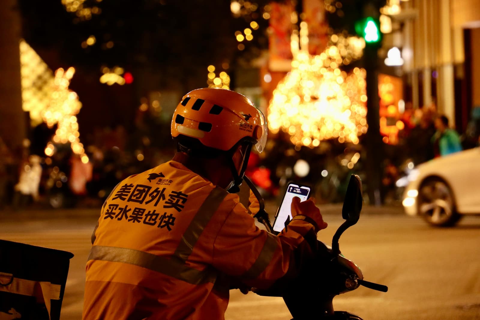 Food-delivery rider in Shanghai on an e-bike